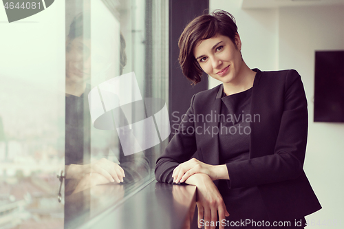 Image of Portrait of successful Businesswoman by the window