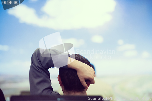 Image of young man dreaming clouds on presentation