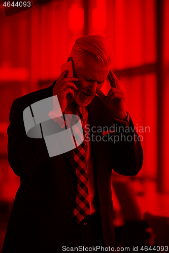 Image of senior business man talk on mobile phone