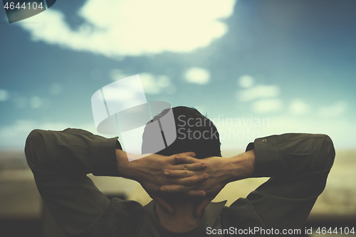 Image of young man dreaming clouds on presentation