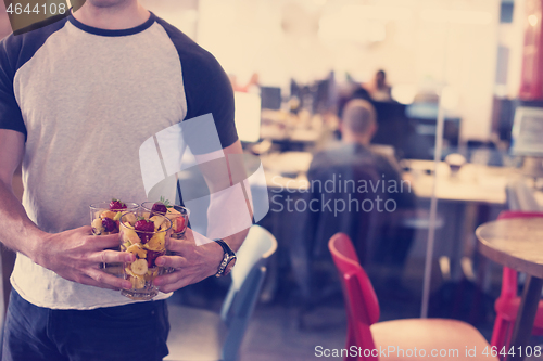Image of software developer eating a fruit salad