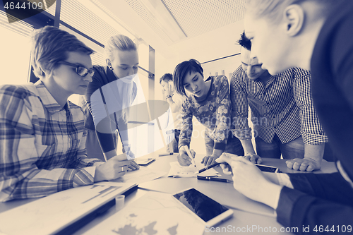 Image of startup business team on meeting at modern office with sunset in