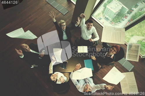 Image of happy business people group on meeting at modern office
