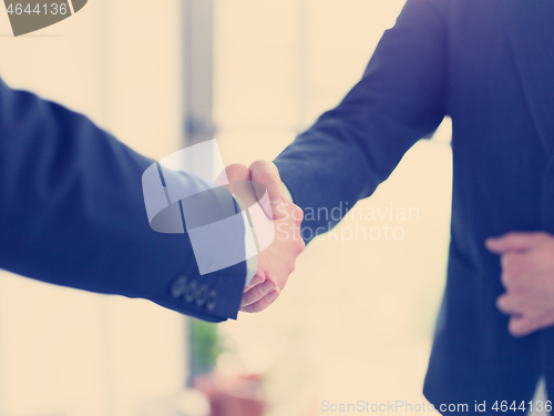 Image of cloasing the deal in modern office interior