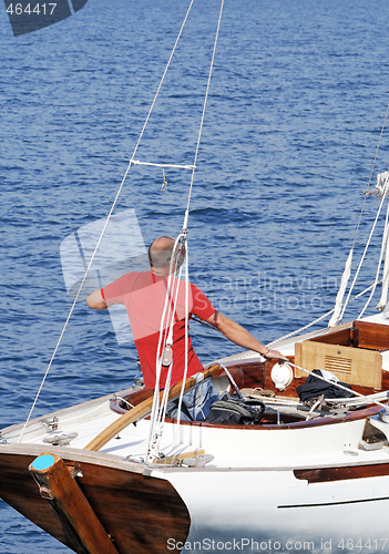 Image of Man on a sailboat