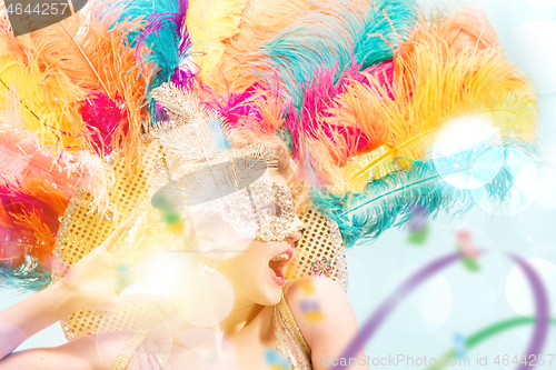 Image of Beautiful young woman in carnival mask