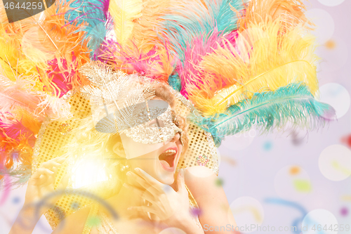 Image of Beautiful young woman in carnival mask