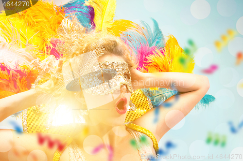 Image of Beautiful young woman in carnival mask