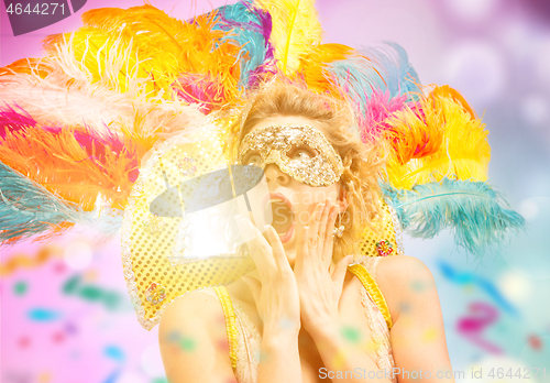 Image of Beautiful young woman in carnival mask