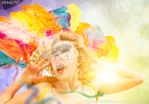 Image of Beautiful young woman in carnival mask