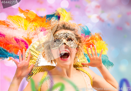 Image of Beautiful young woman in carnival mask