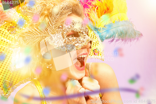 Image of Beautiful young woman in carnival mask