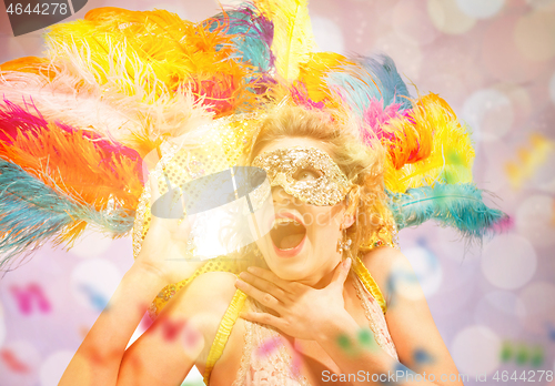 Image of Beautiful young woman in carnival mask