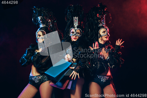 Image of young beautiful dancers posing on studio background