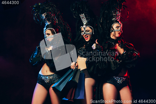 Image of young beautiful dancers posing on studio background