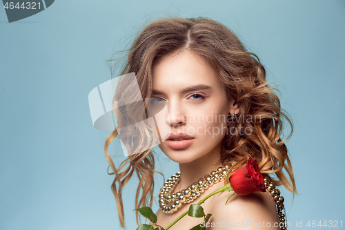 Image of Beautiful young girl in studio with pearl jewelry - earrings, bracelet, necklace.