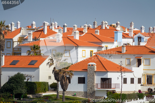 Image of Tiled roofs of small town houses in Portugal