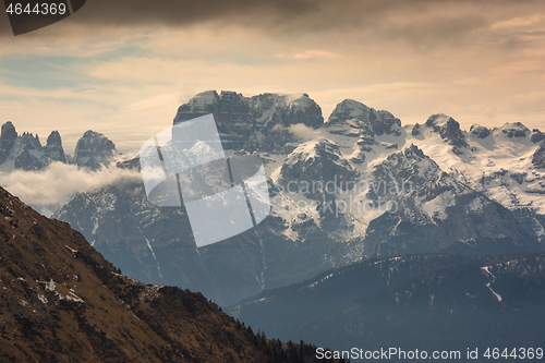 Image of Snow-capped alps mountains in clouds