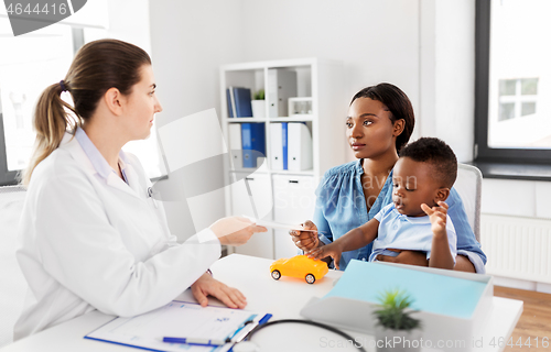 Image of mother with baby son and doctor at clinic