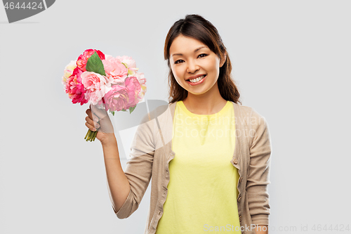 Image of happy asian woman with bunch of flowers