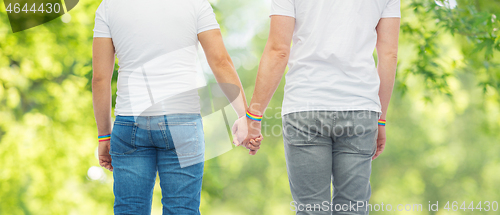 Image of male couple with gay pride rainbow wristbands