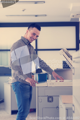 Image of young  business man copy documents