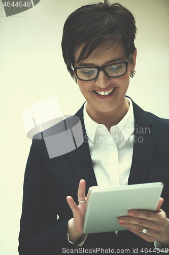 Image of business woman working on tablet