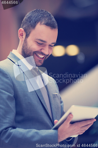 Image of business man with tablet