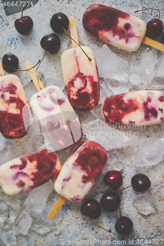 Image of Delicious, homemade popsicles made from cherries and cream.