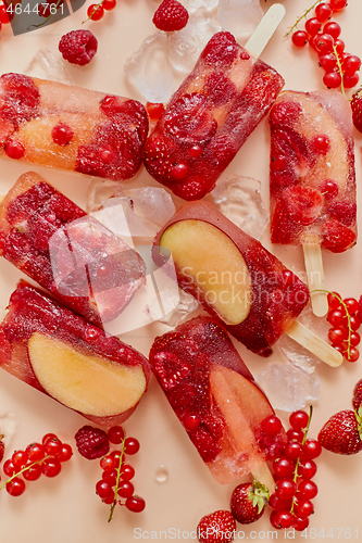 Image of Homemade frozen various red berries natural juice popsicles - paletas - ice pops