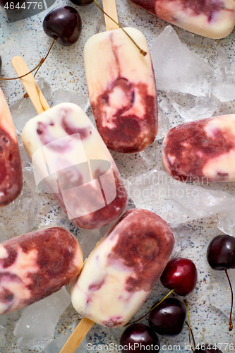 Image of Delicious, homemade popsicles made from cherries and cream.