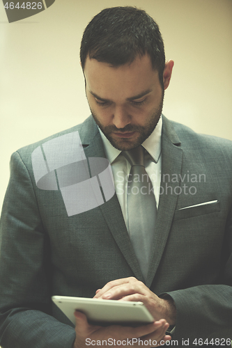 Image of business man with tablet