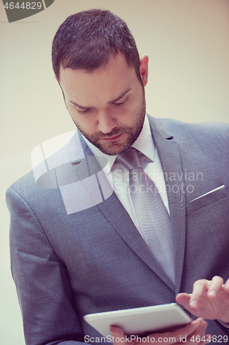 Image of business man with tablet