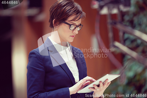 Image of business woman working on tablet