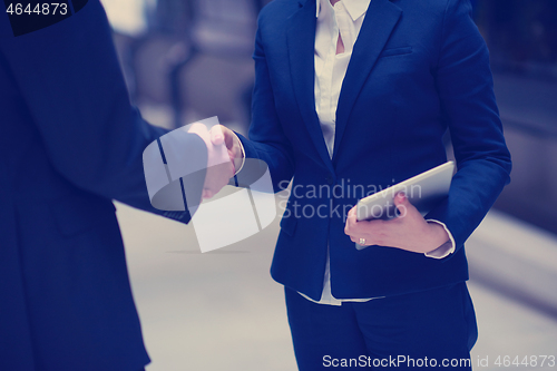 Image of business man and woman hand shake