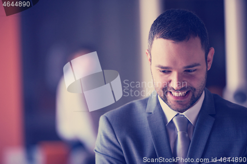 Image of young business man portrait  at modern office