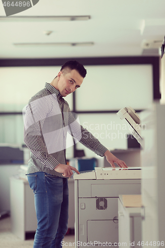 Image of young  business man copy documents