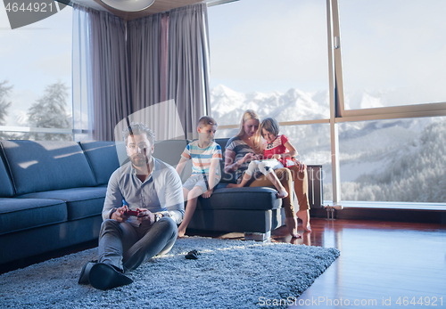 Image of Happy family playing a video game