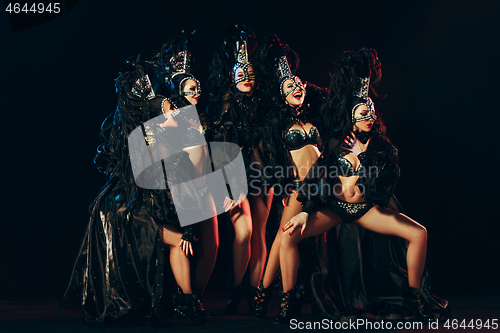 Image of young beautiful dancers posing on studio background