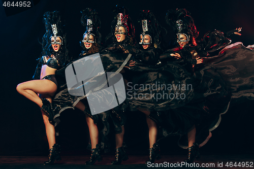 Image of young beautiful dancers posing on studio background