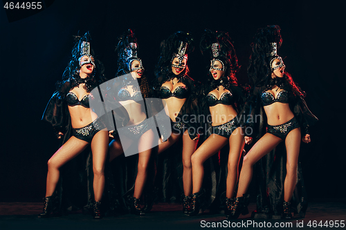 Image of young beautiful dancers posing on studio background