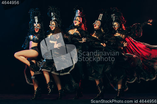 Image of young beautiful dancers posing on studio background