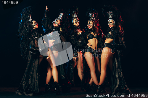 Image of young beautiful dancers posing on studio background