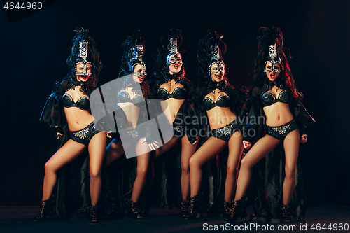 Image of young beautiful dancers posing on studio background