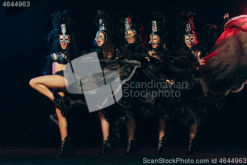 Image of young beautiful dancers posing on studio background