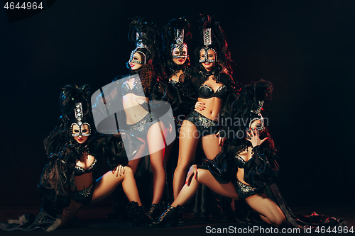 Image of young beautiful dancers posing on studio background