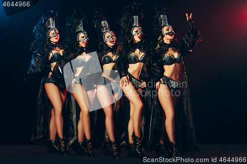 Image of young beautiful dancers posing on studio background