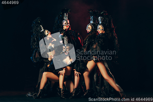 Image of young beautiful dancers posing on studio background