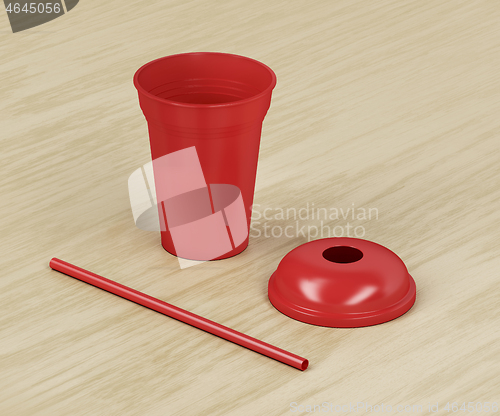 Image of Red disposable plastic cup and straw