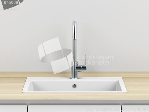 Image of Silver faucet and white sink in the kitchen